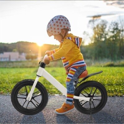 young boy rides bike